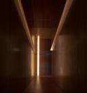 Dark hallway with a light at the end