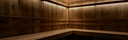Wooden sauna interior with bench and illuminated panels
