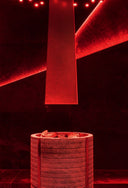 Red light fixture on a dark background